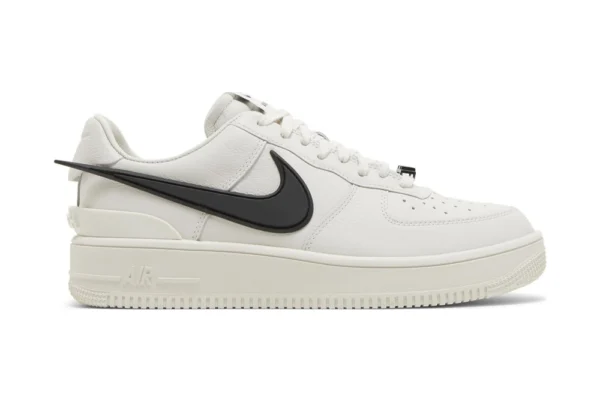 The AMBUSH x Air Force 1 Low 'Phantom' rep sneakers captivate with their sleek Phantom gray colorway and AMBUSH's innovative design touches.